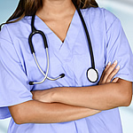 woman in purple scrubs with stephoscope